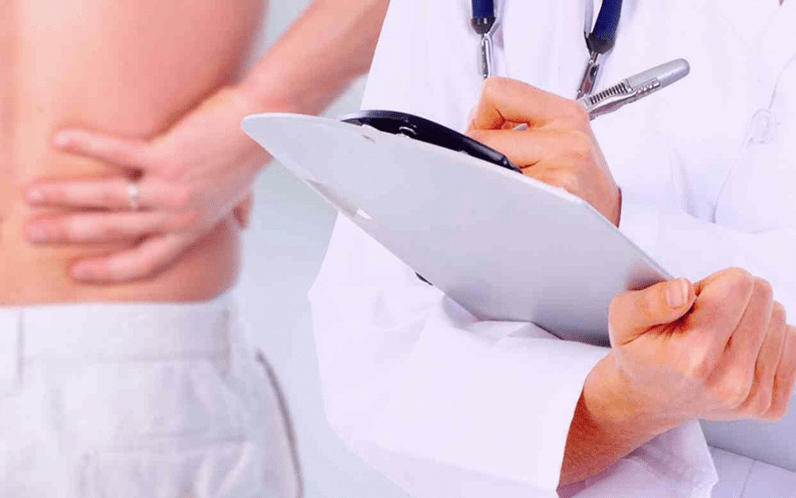 doctor prescribes treatment for low back pain